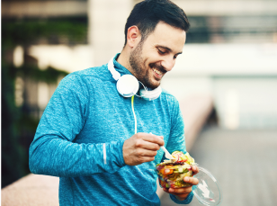 Person outside, eating a healthy snack on the go